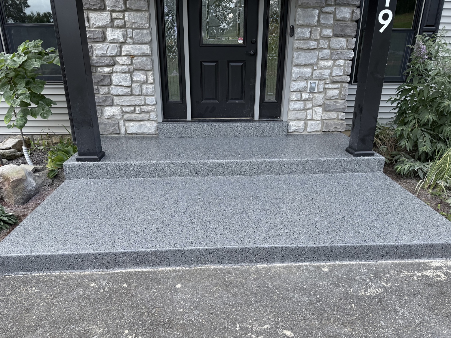 Grey flake coating on a front porch and steps at a Boyertown area home