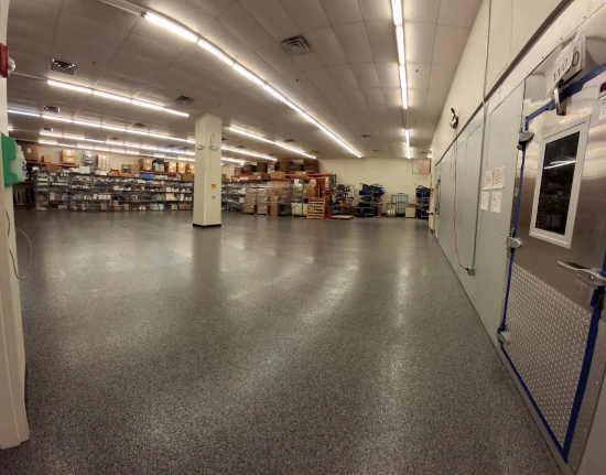 Large flake epoxy floor running through a commercial stockroom